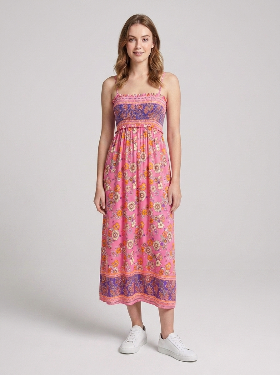 Women's summer dress featuring a smocked bodice and tiered flowing skirt