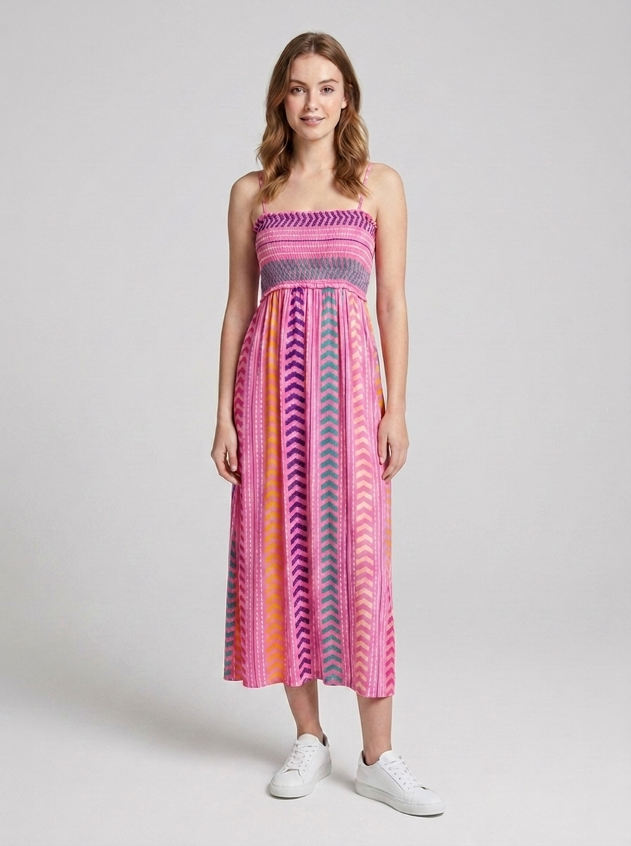 Women's floral smocked maxi dress featuring adjustable shoulder straps and a flowing tiered skirt
