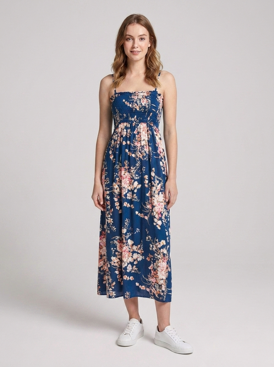 Sleeveless floral dress featuring a flowing tiered design for summer styling