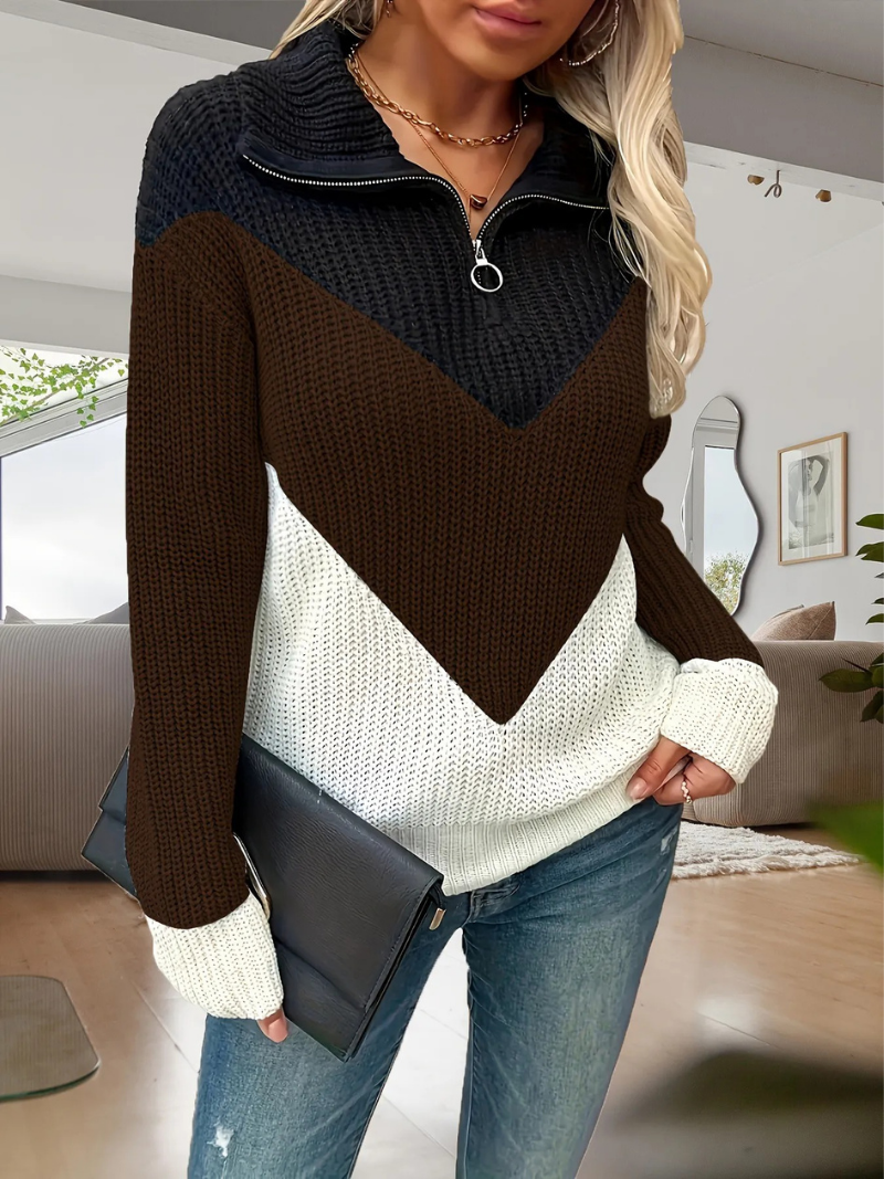 Back of zip-up knitted cardigan displaying ribbed texture and tapered waist detail