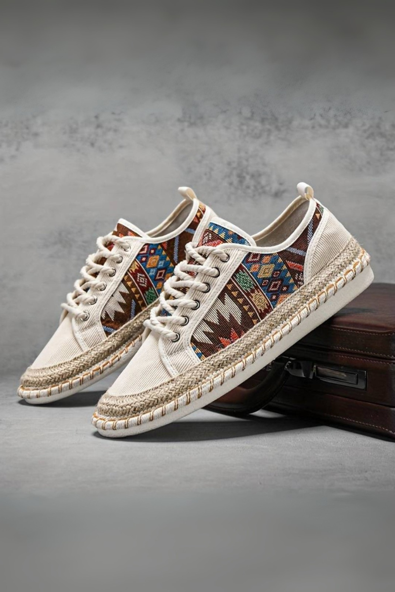 Trainers displaying woven trim detail and secure lace fastening