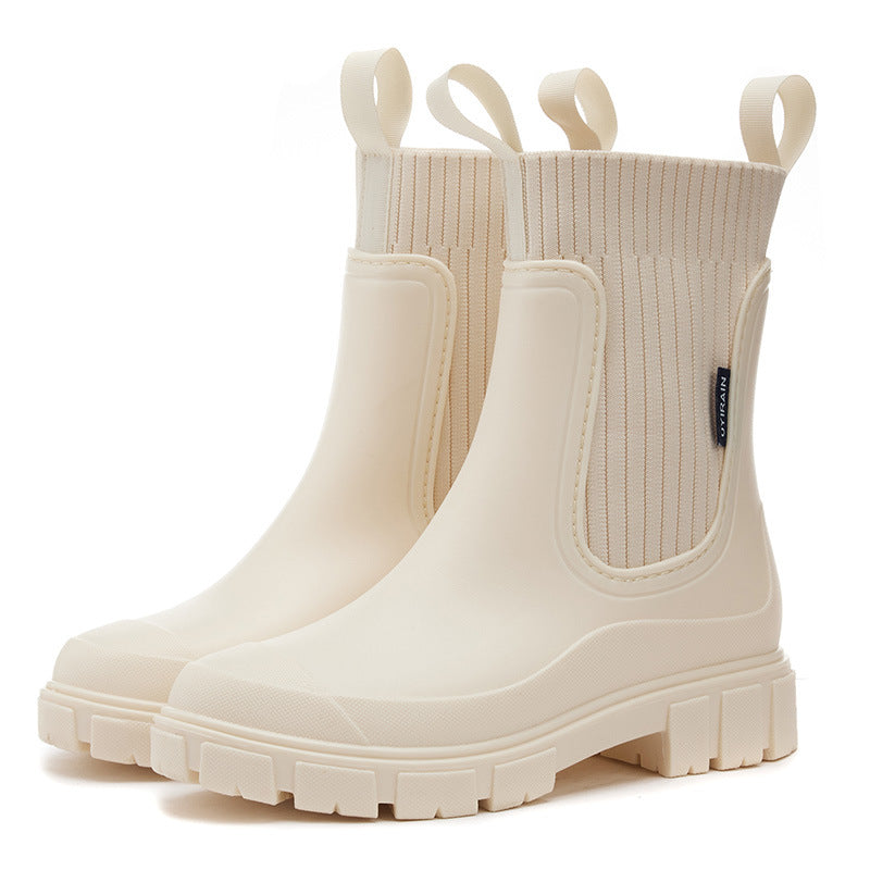 Women's white PVC ankle boots with elastic closure, casual everyday style