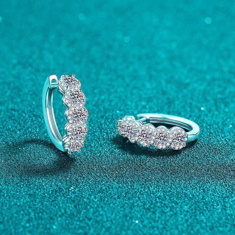 Sterling silver pendant earrings featuring stone embellishment worn on ear