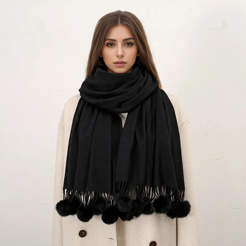 Cashmere scarf featuring pom pom detail fringe close-up