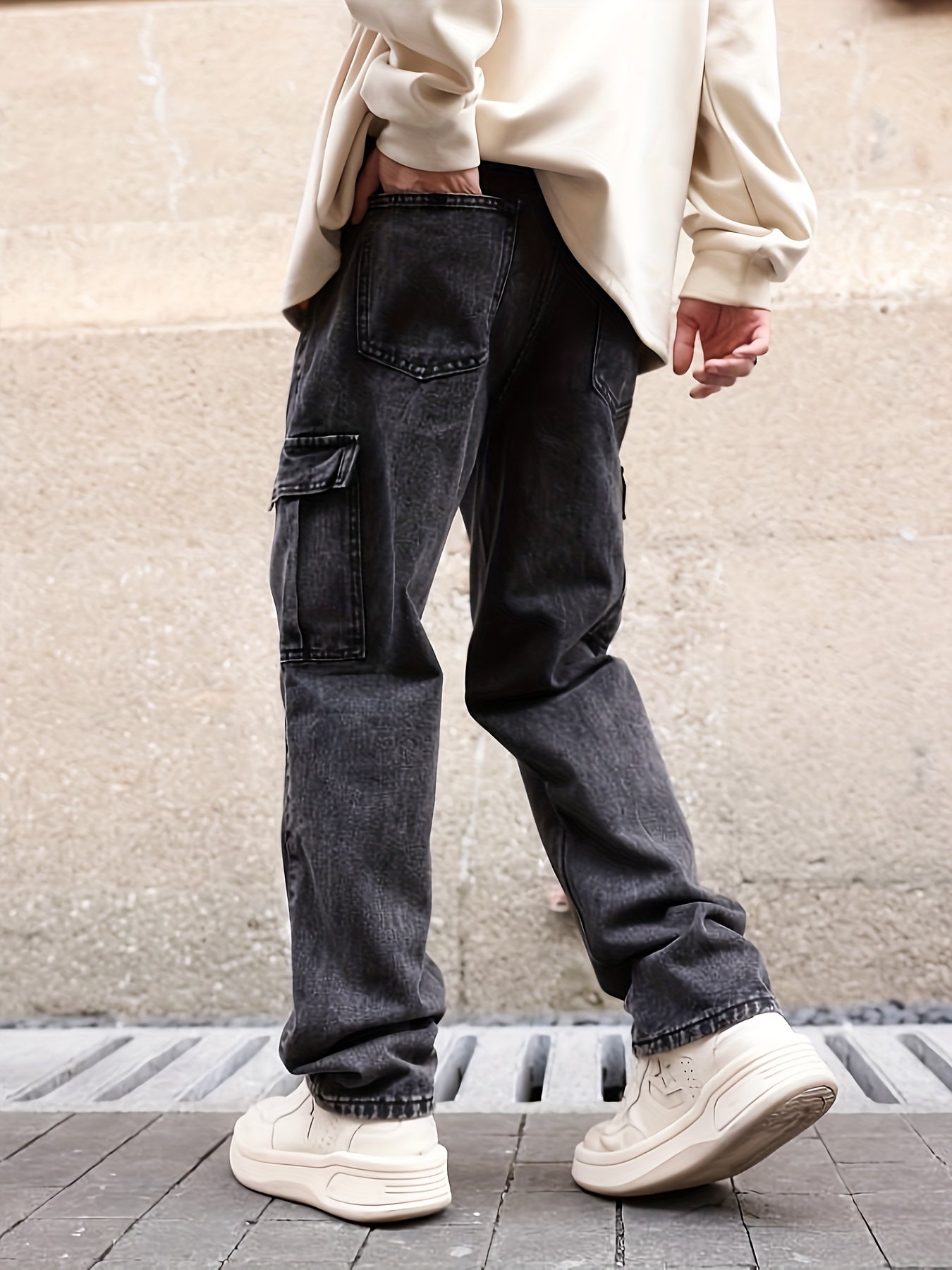 Denim cargo trousers featuring multiple pockets and relaxed silhouette