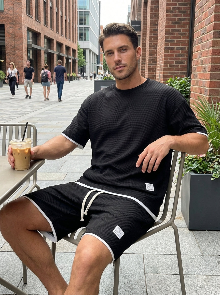 Men's slim fit two-piece set in black with short-sleeve T-shirt and matching shorts