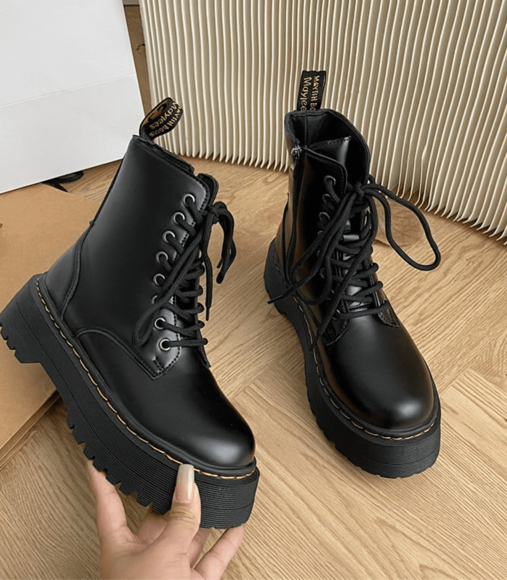 side view of platform combat boots showing thick rubber sole and ankle height