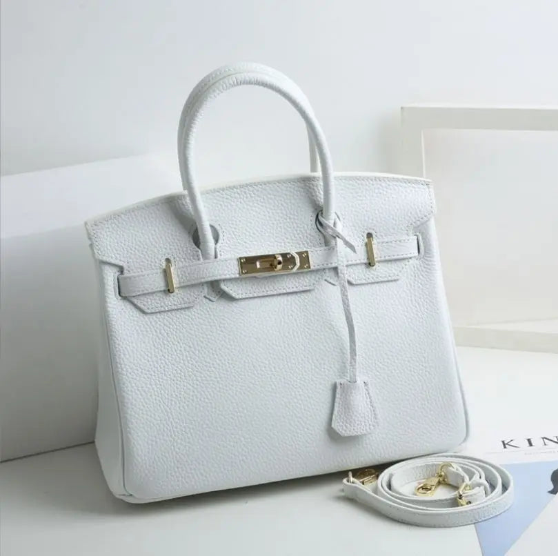 structured handbag featuring metallic turn-lock closure detail