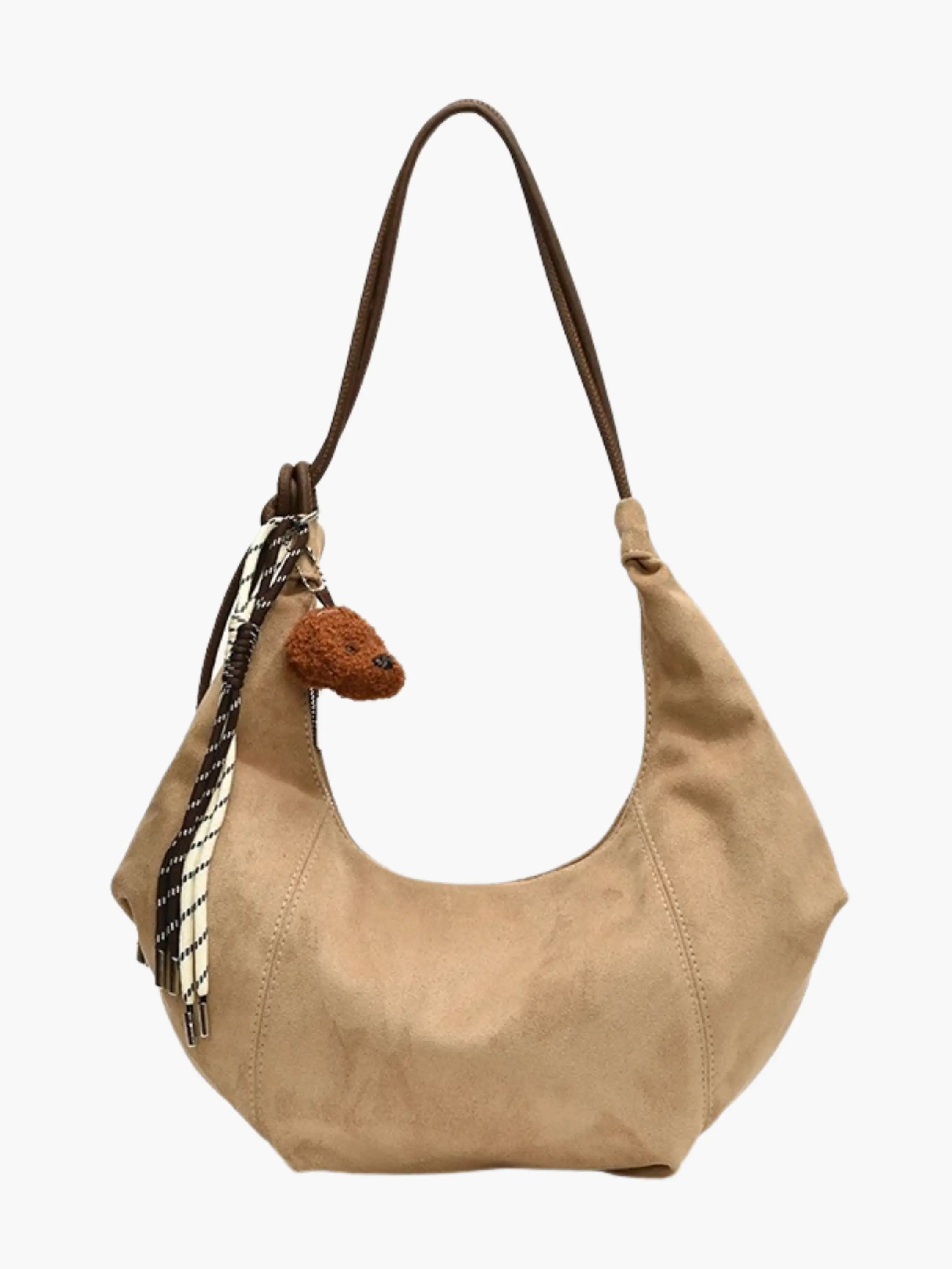 relaxed silhouette hobo bag in suede with decorative charm closeup