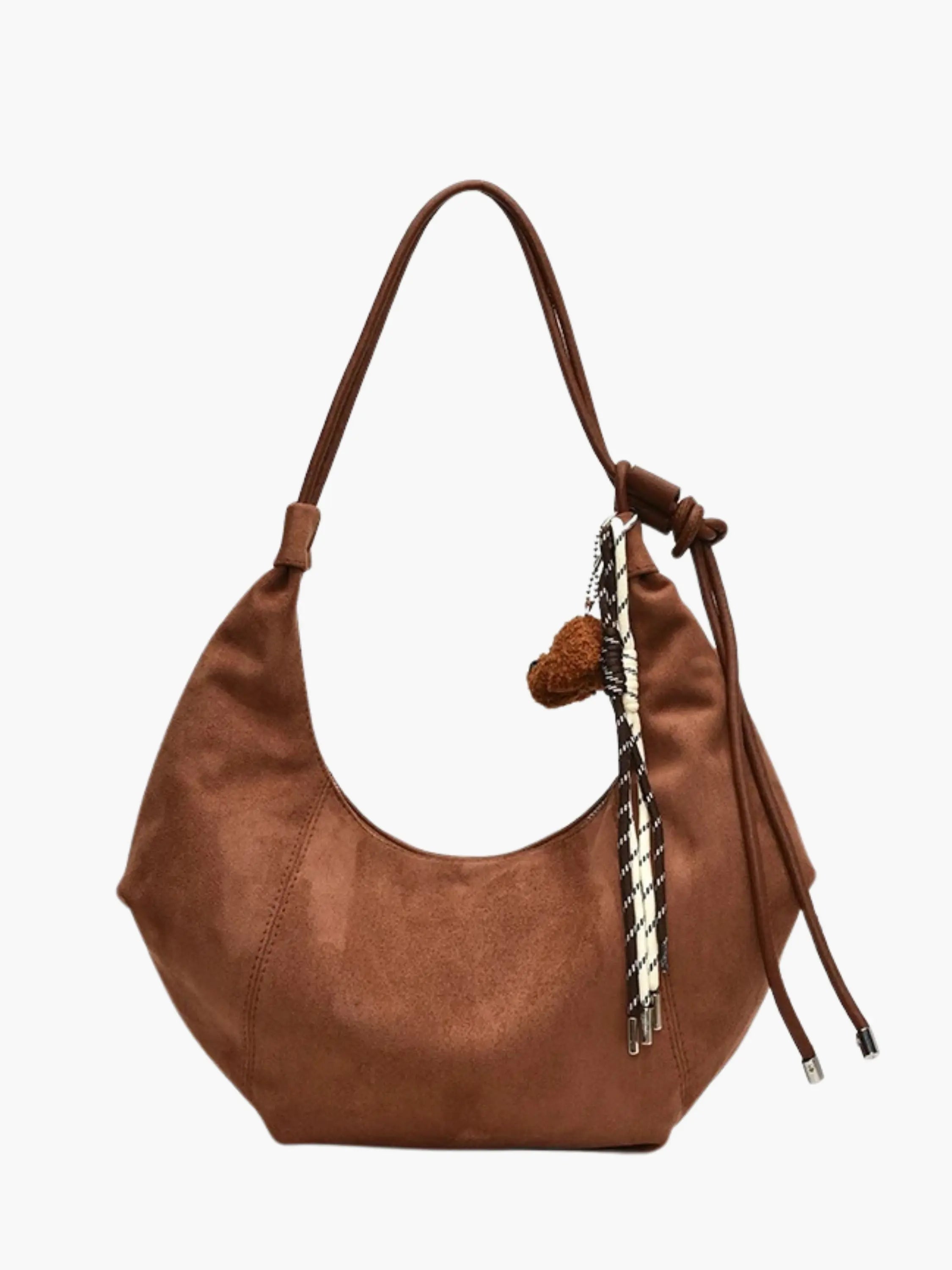 soft suede shoulder bag with top zip closure and interior compartment