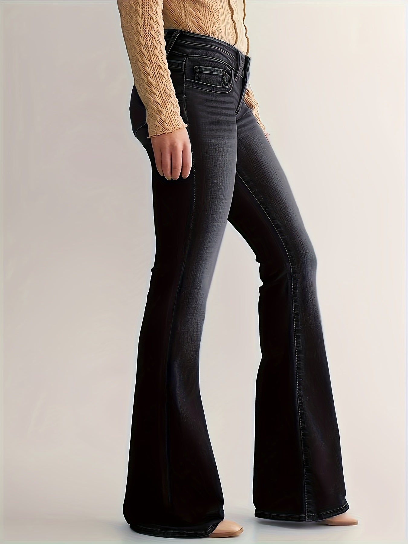 Denim flared jeans with full length leg on model