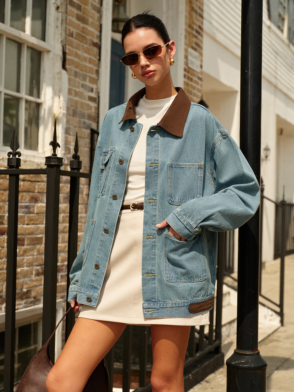 Front view of a cotton denim jacket with a contrast collar, button fastening and flap chest pockets for women