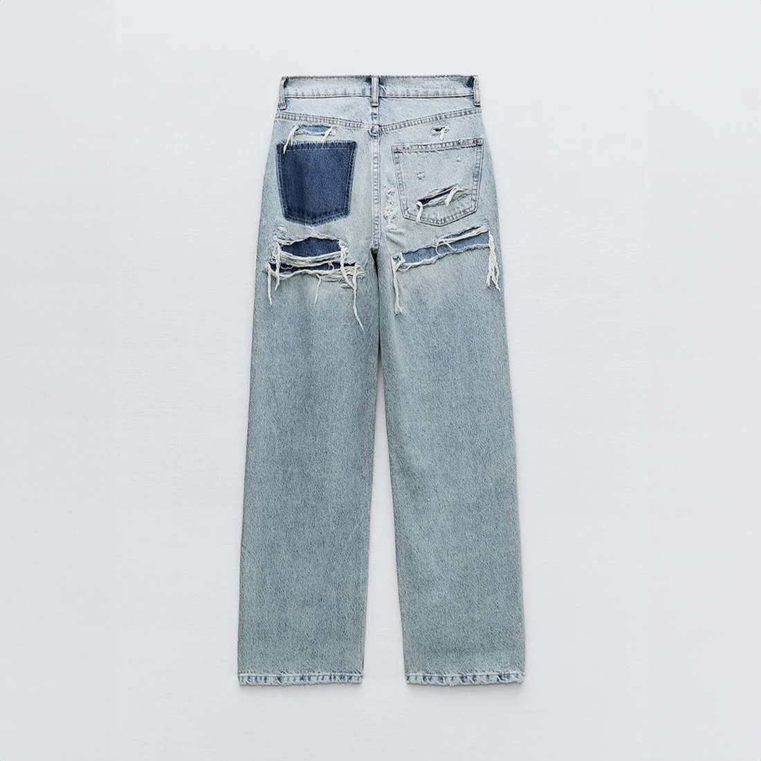 Full-length women's blue ripped jeans in spandex stretch fabric