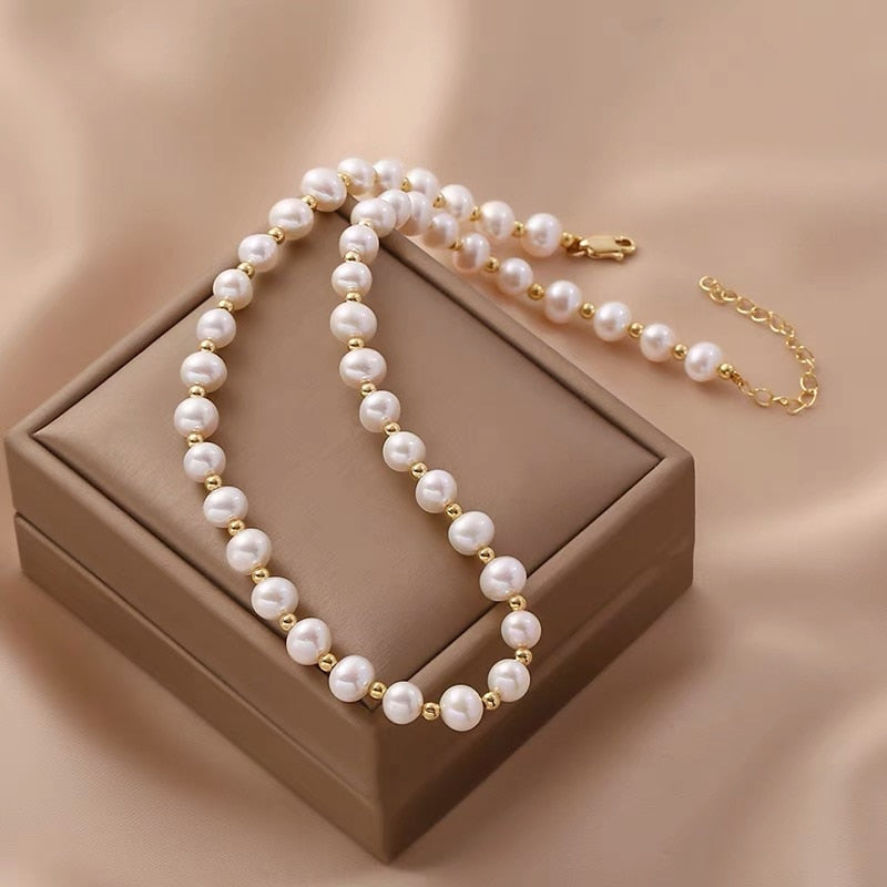 Freshwater pearl pendant necklace for women with alloy chain on white background