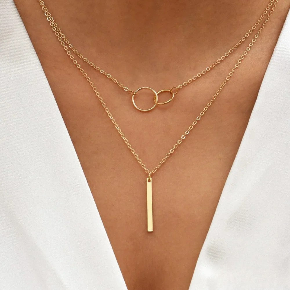 Gold-plated necklace with interlocking circle pendant on delicate chain