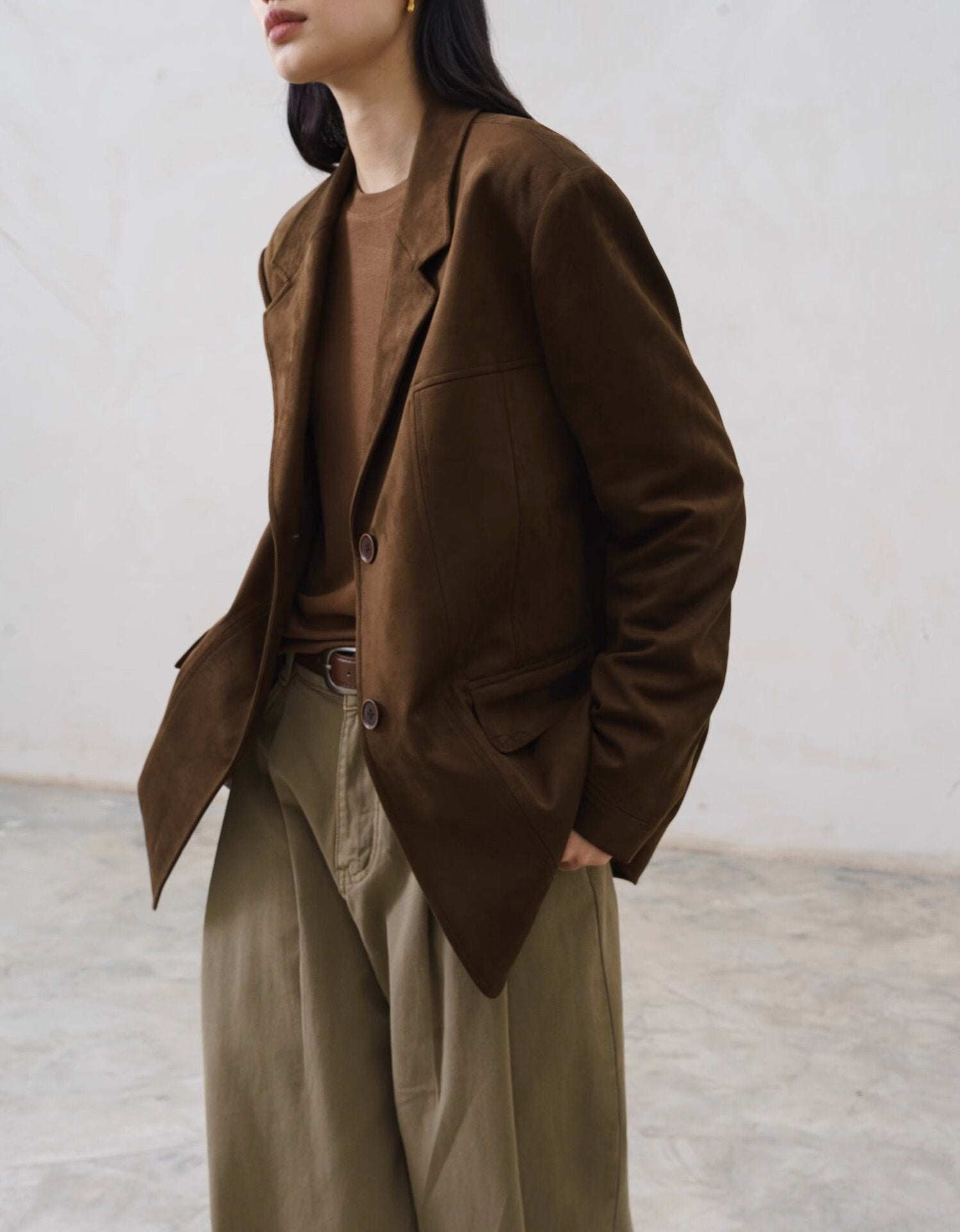 tailored wool jacket with front button closure and fitted waist