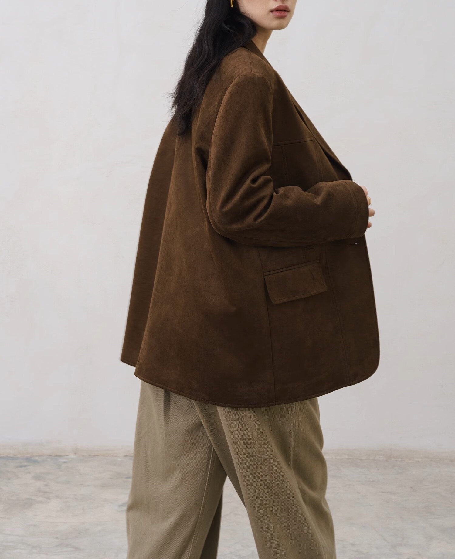 tailored jacket detail highlighting fabric texture and button placement