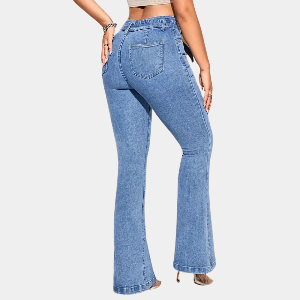 slim fit flared jeans in denim material shown at three quarter angle highlighting leg shape