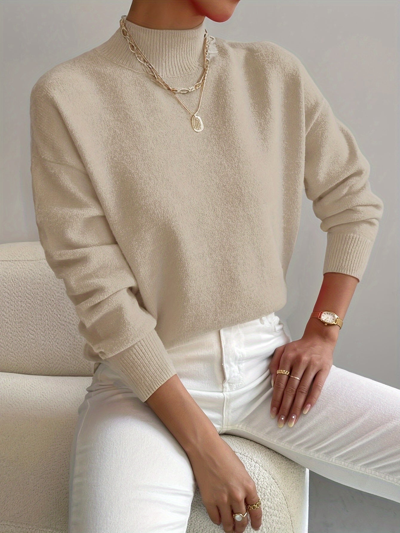 Cable-knit pullover featuring dropped shoulders relaxed fit for layering
