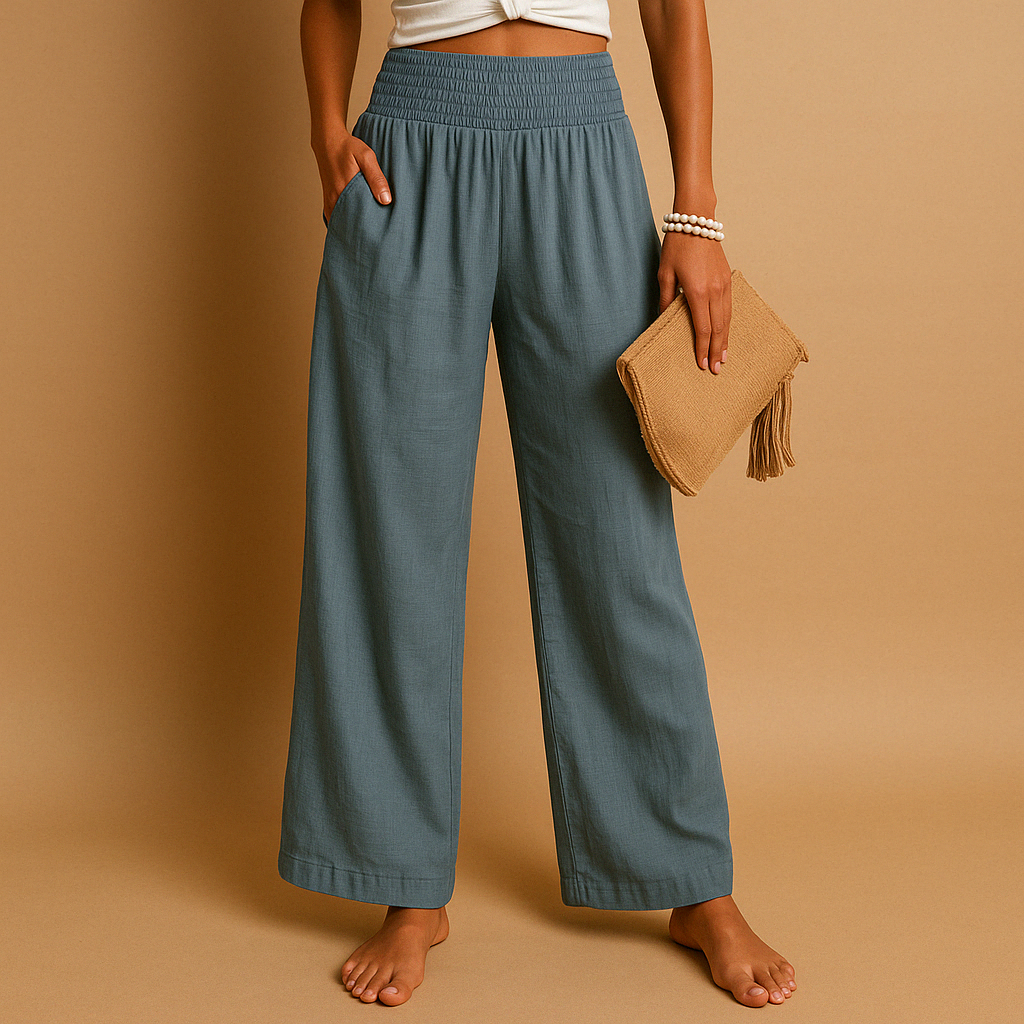 Women's polyester trousers featuring a flowing wide leg silhouette and side pockets