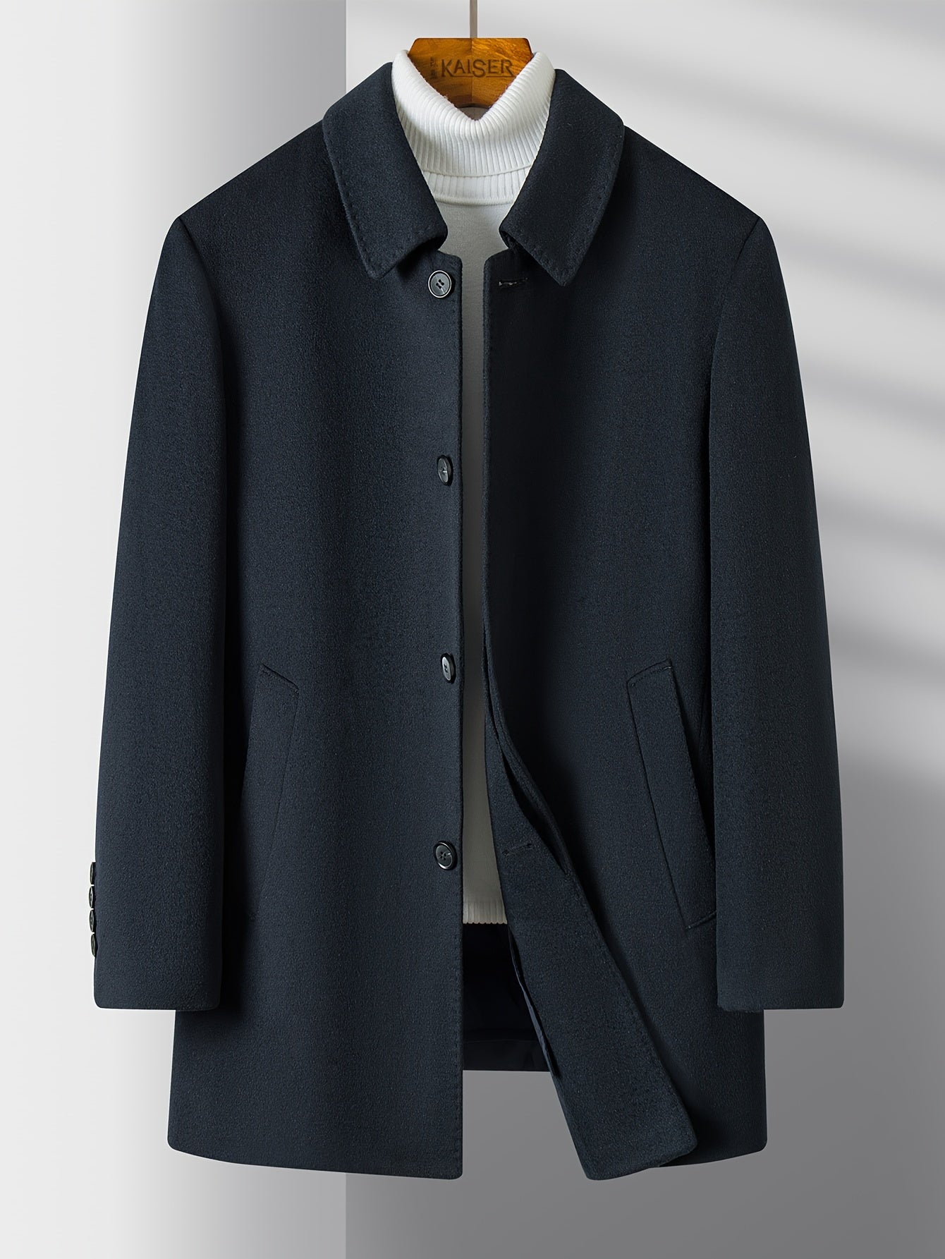 mens smart overcoat in wool fabric showing lapel detail and fit