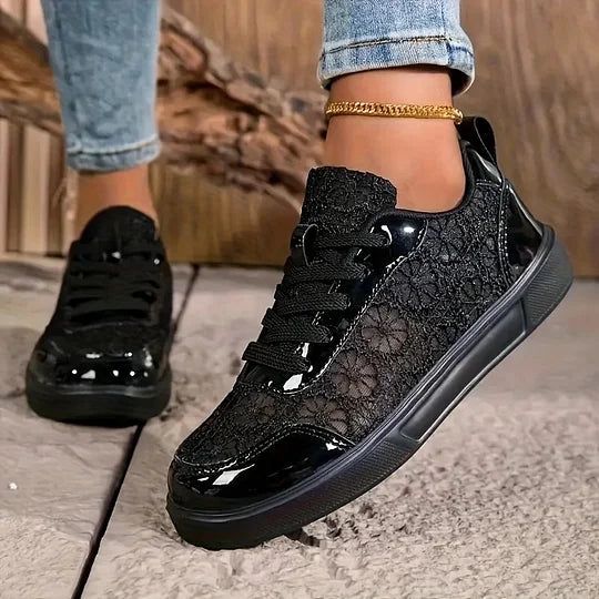 Women's black lace-up mesh sneakers, side view, low-top casual fit