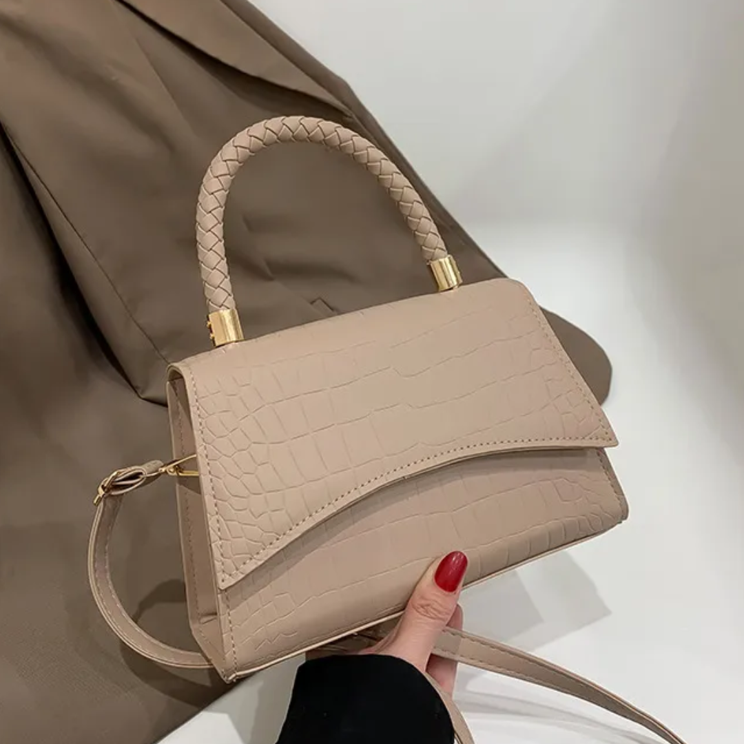 Structured handbag in faux leather with dual carry options for everyday use