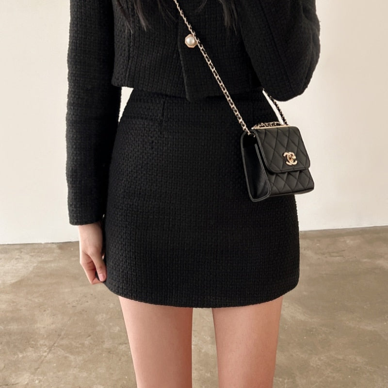 Black polyester blazer and skirt matching set for women — structured two-piece tailored suit, detail view