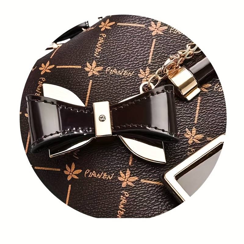 Structured handbag with angular design and detachable strap