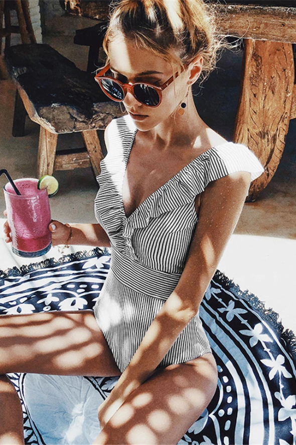 Women's fitted one piece swimsuit with ruffle neckline