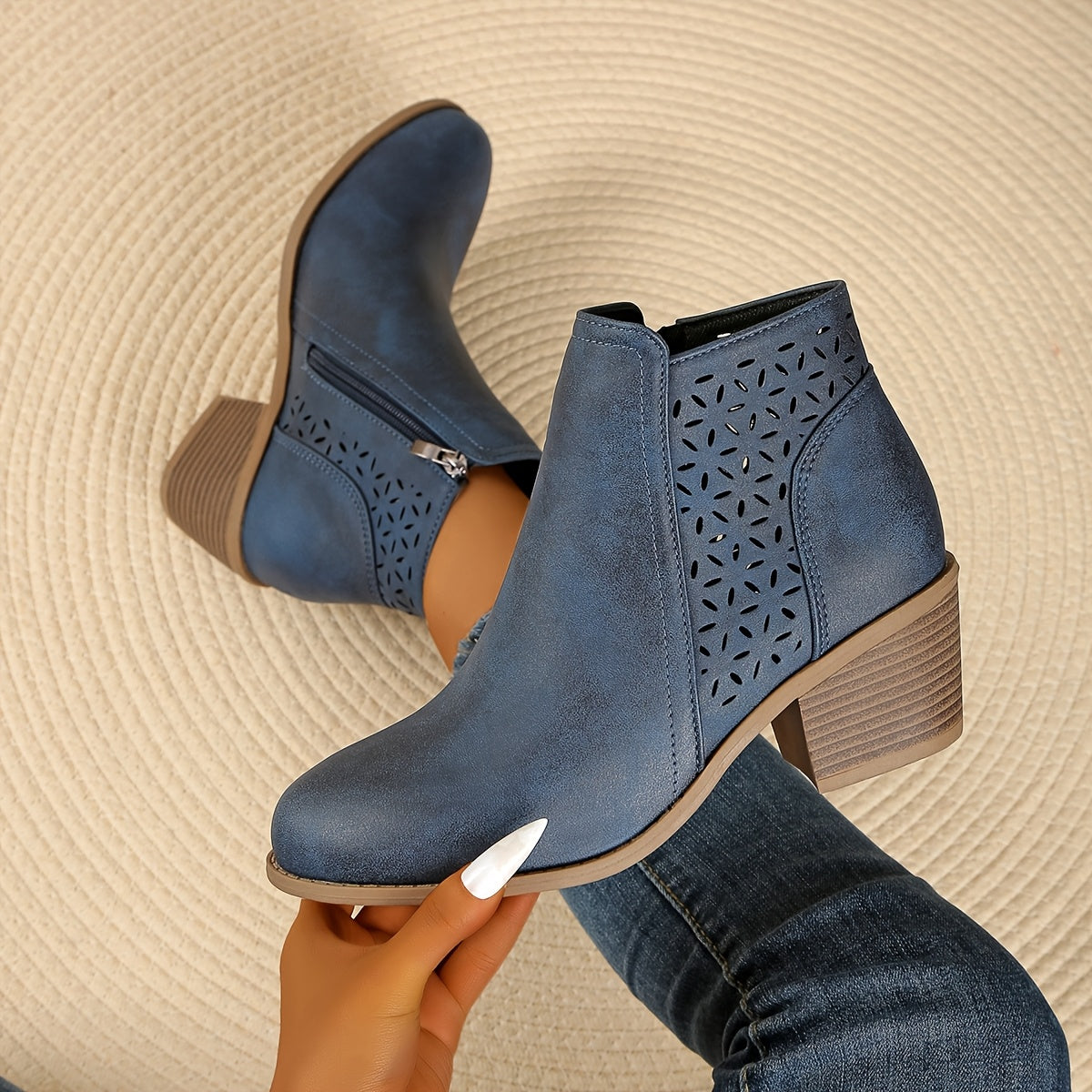 Back angle of casual ankle boots with synthetic leather construction and platform base