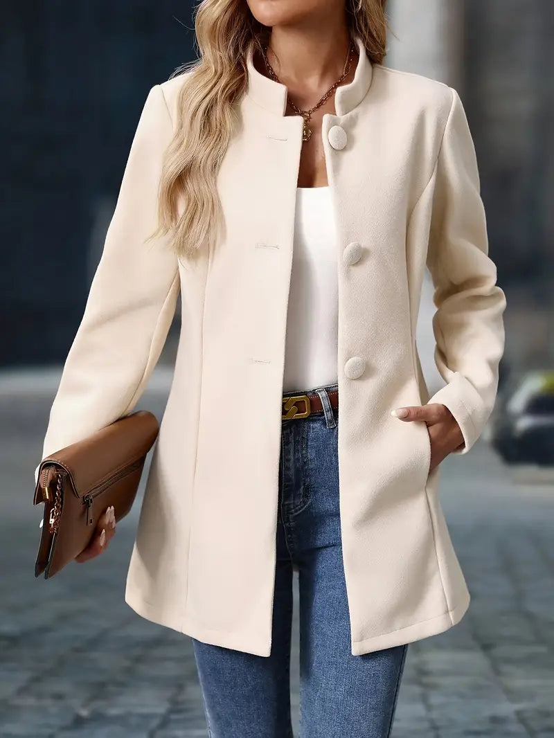 Wool coat showing button closure detail and lapel construction for women