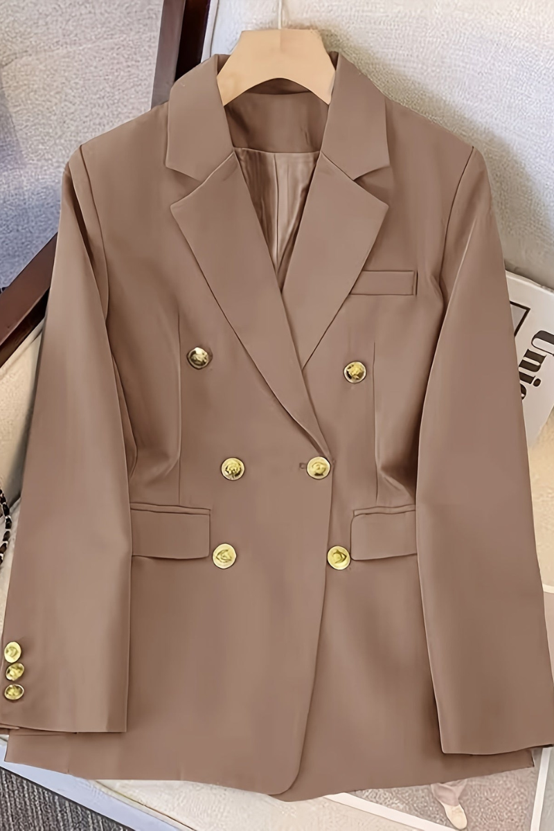 structured blazer displaying button closure and shoulder padding