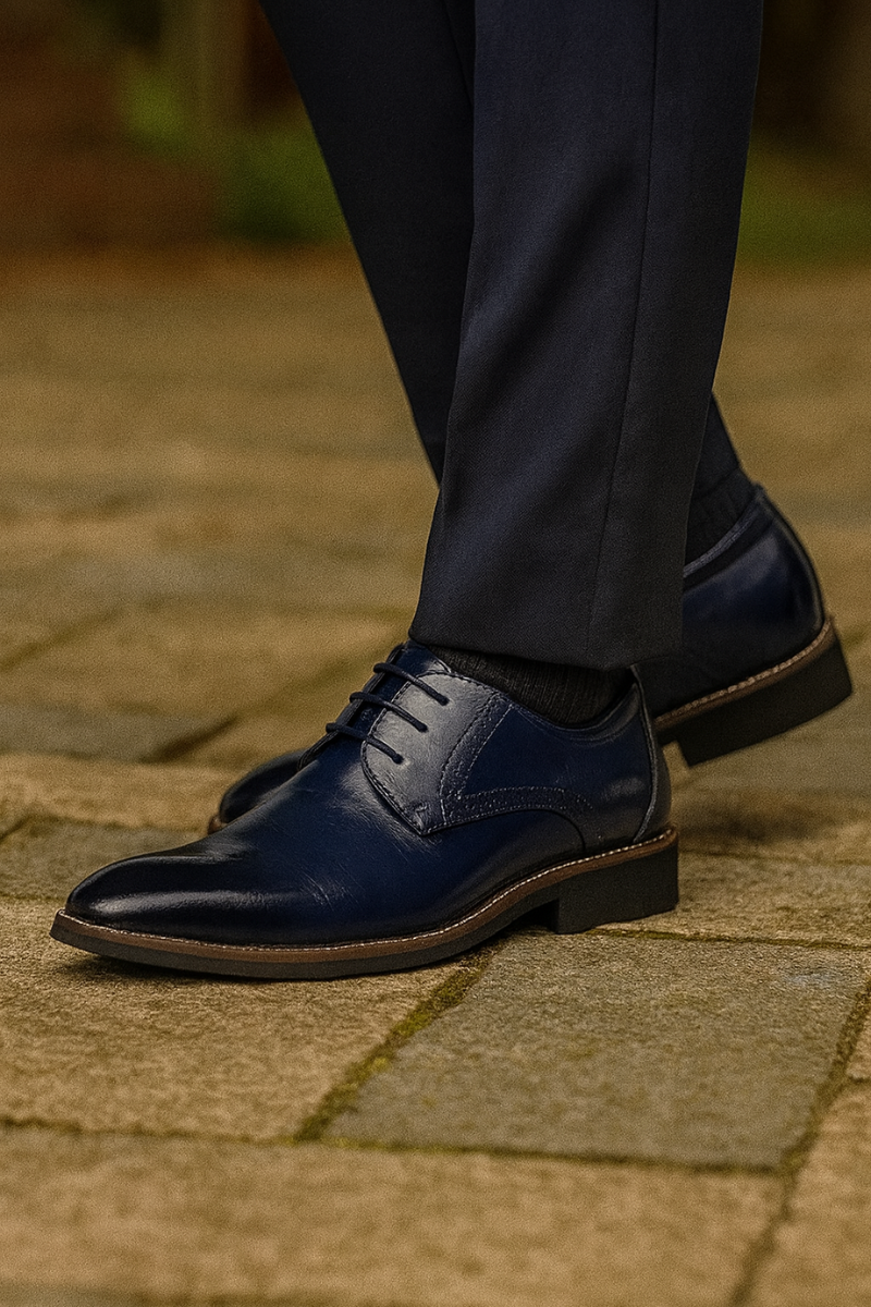 dress shoes in leather showing detailed stitching and rubber sole from side