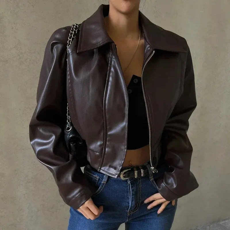 faux leather cropped jacket with front zipper closure on model from front angle