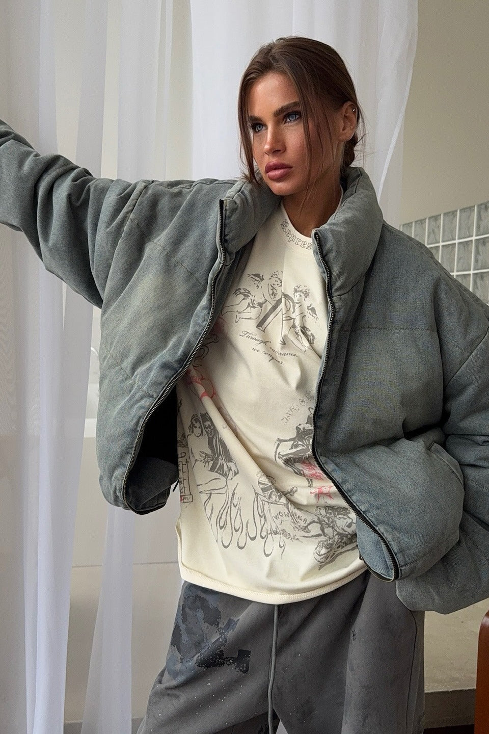 Padded denim jacket with front zip closure and relaxed silhouette