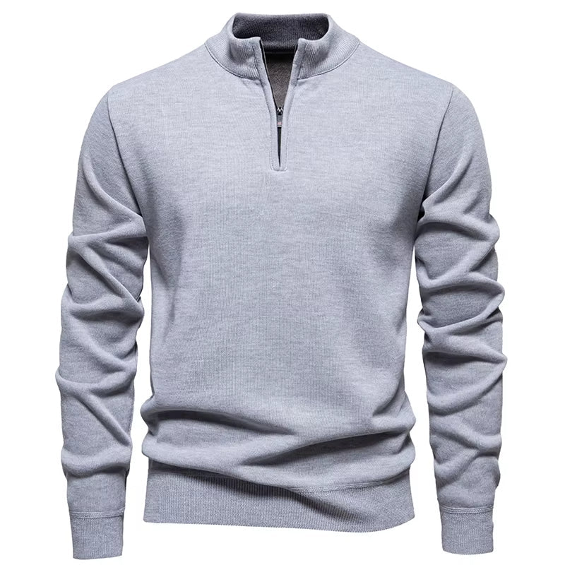 Wool blend knit sweater featuring ribbed texture and half-zip detail in slim fit for men