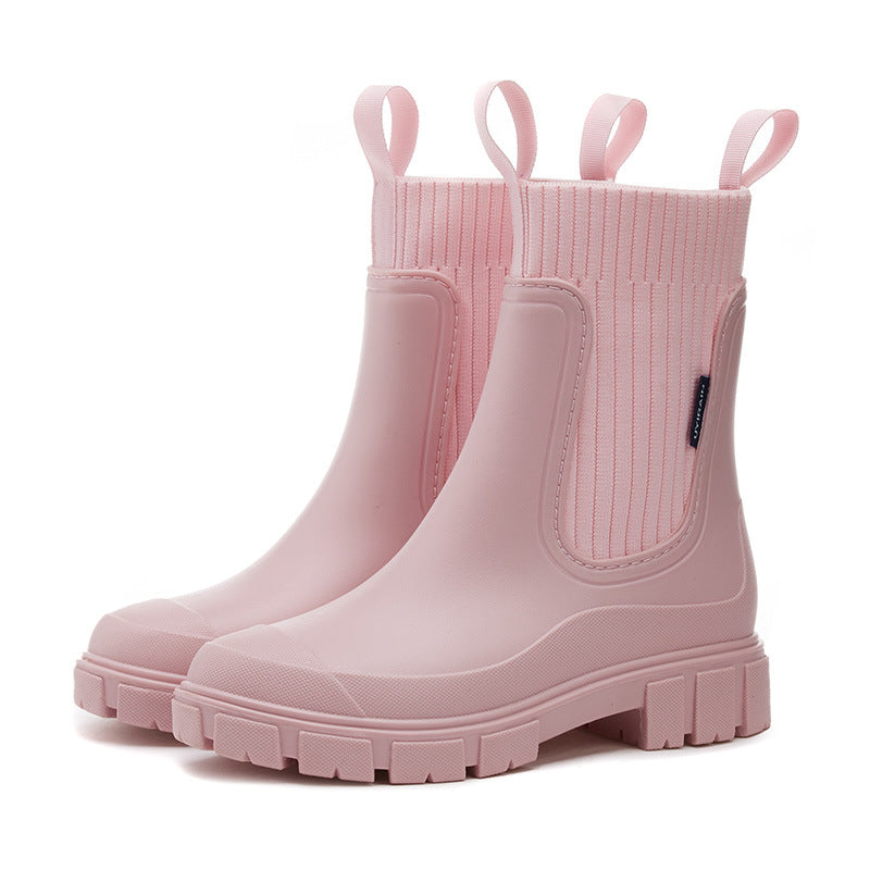 Women's pink PVC ankle boots with elastic closure, casual fit, front view