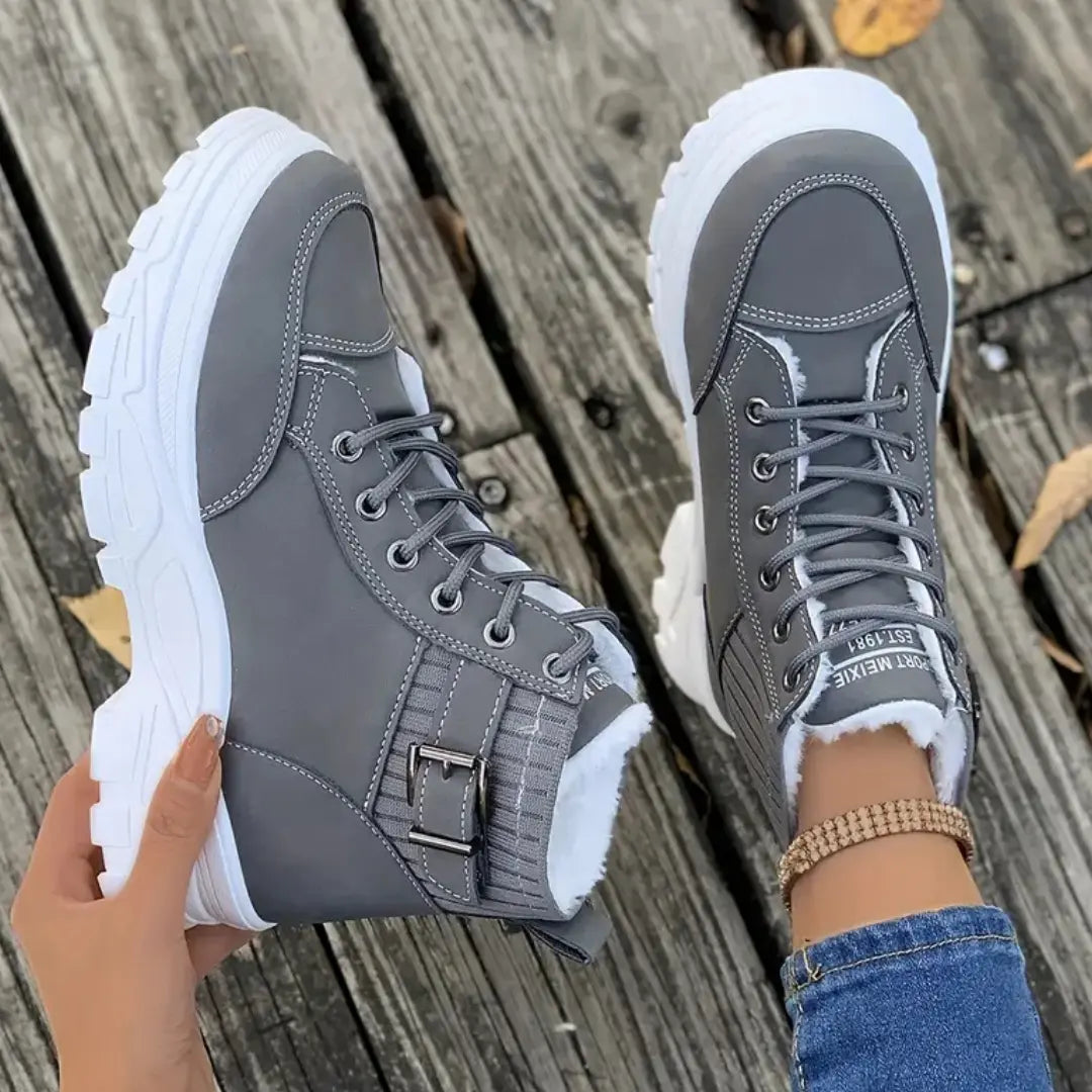 Women's platform boots with front lacing and raised sole design