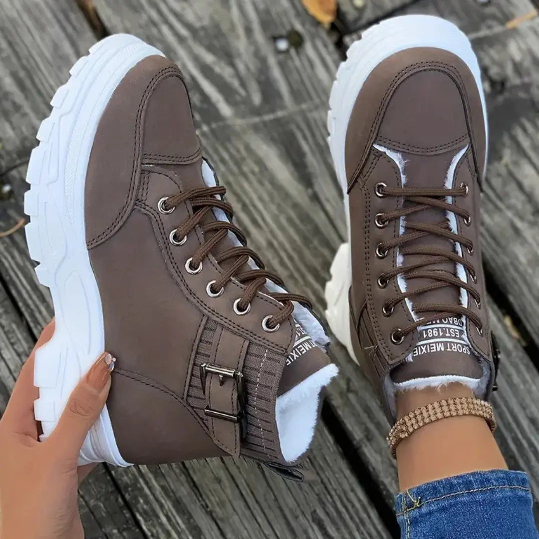 Synthetic leather boots with platform heel and lace-up detail