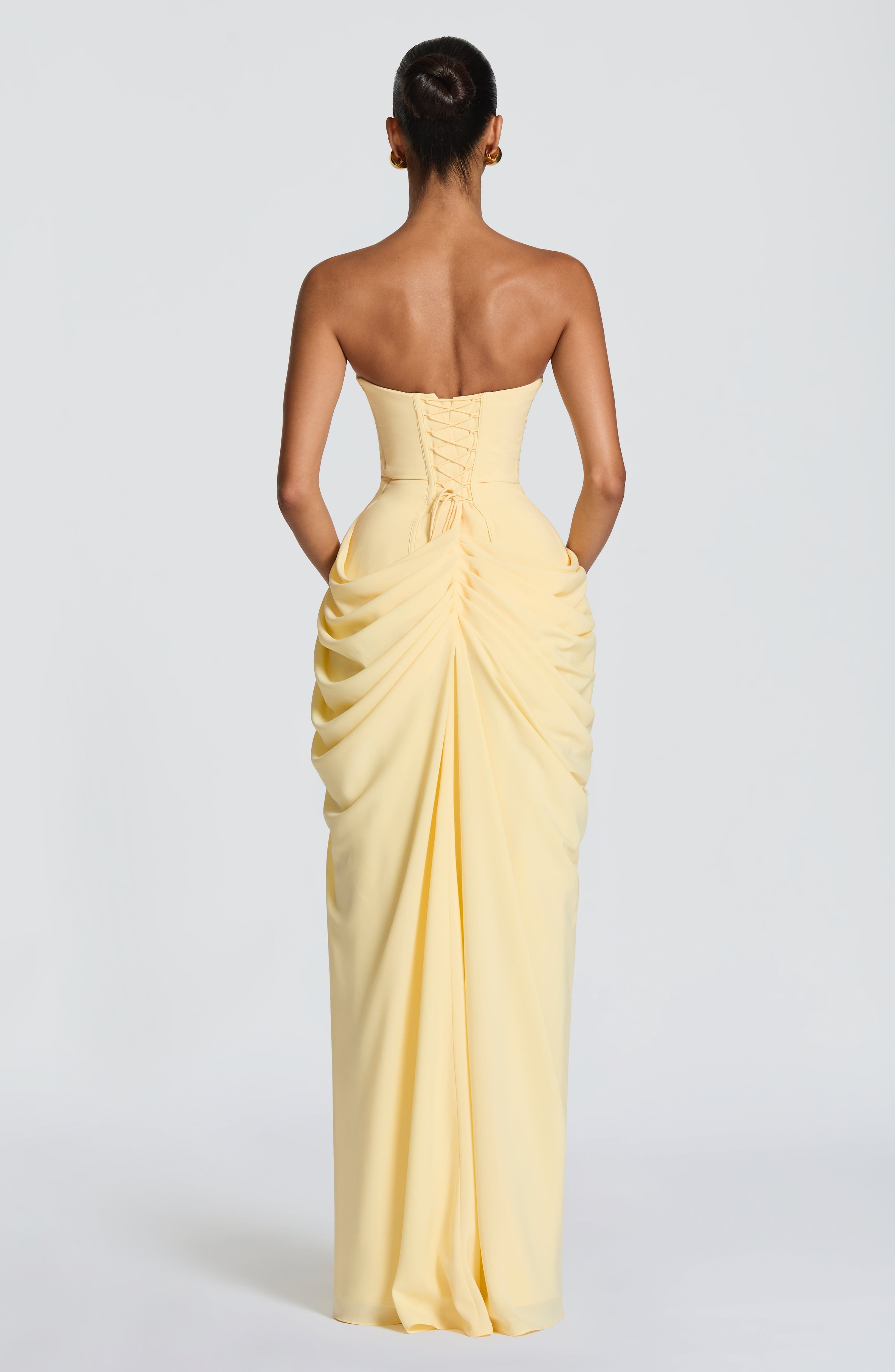 Women's chiffon maxi dress with strapless neckline, side or back angle view