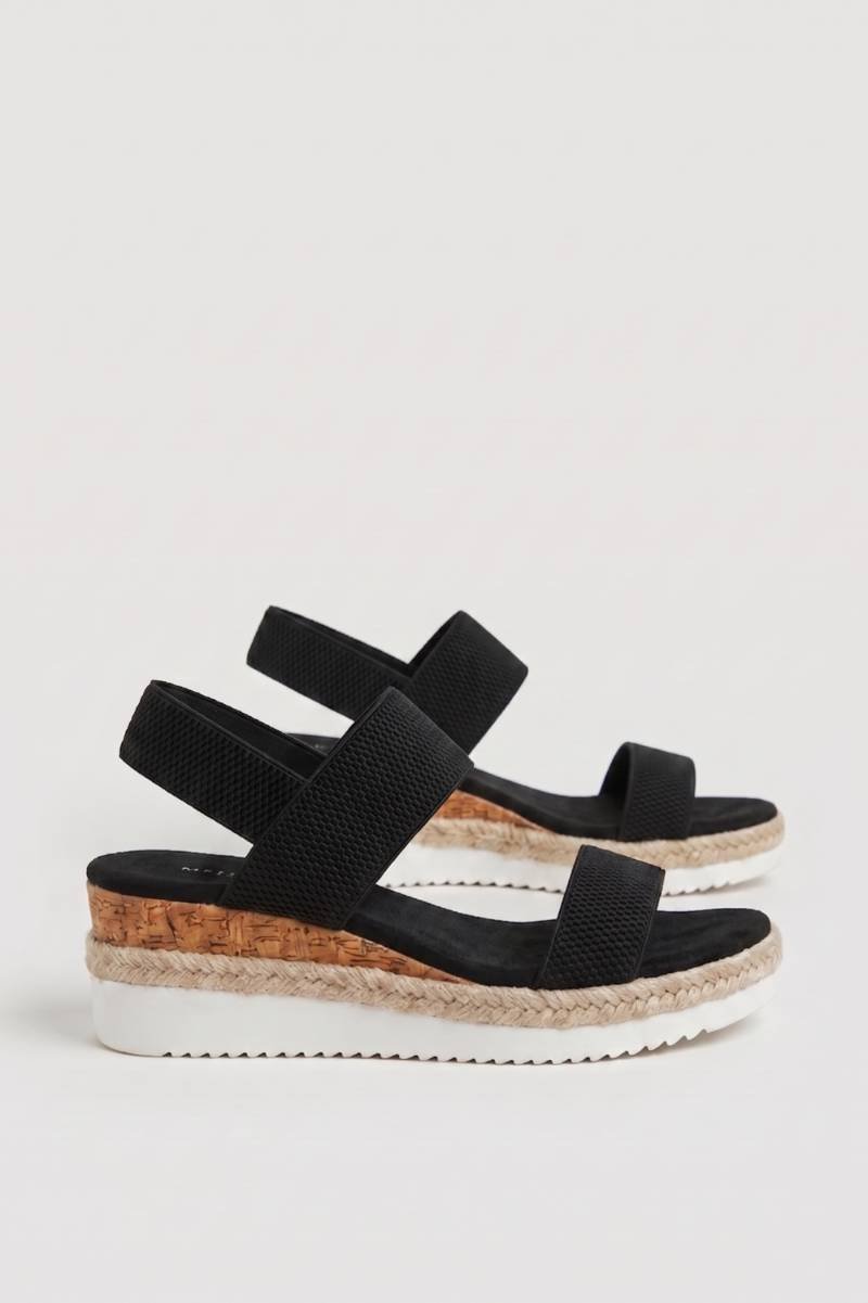 Women's black platform espadrille sandals with elastic closure and fabric upper