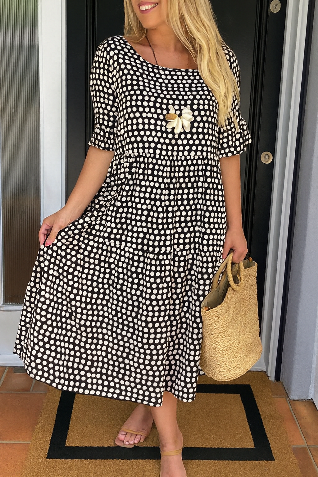 Women's black short sleeve relaxed fit midi dress with rounded neckline