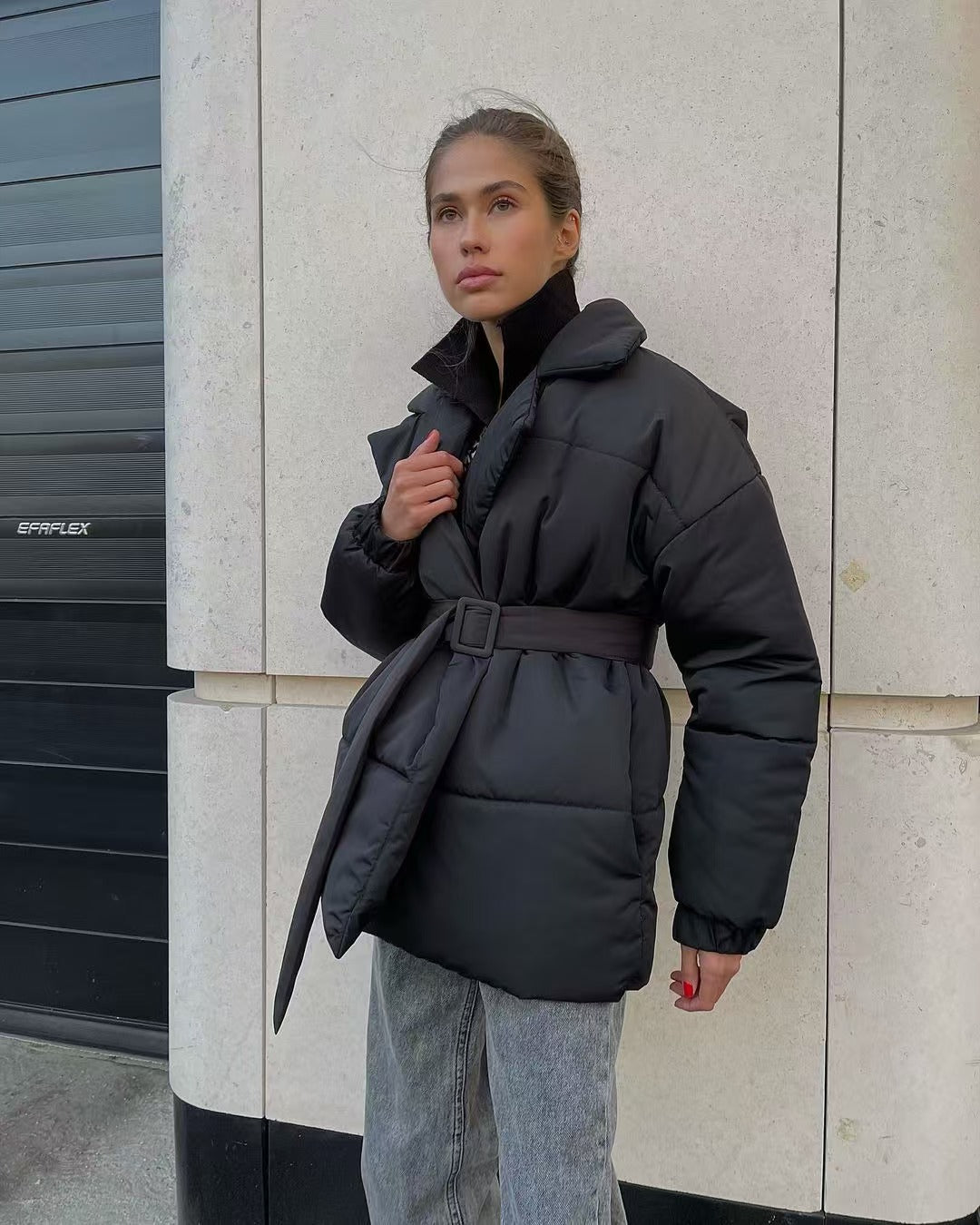 Quilted puffer jacket showing front zip and fitted cut for women
