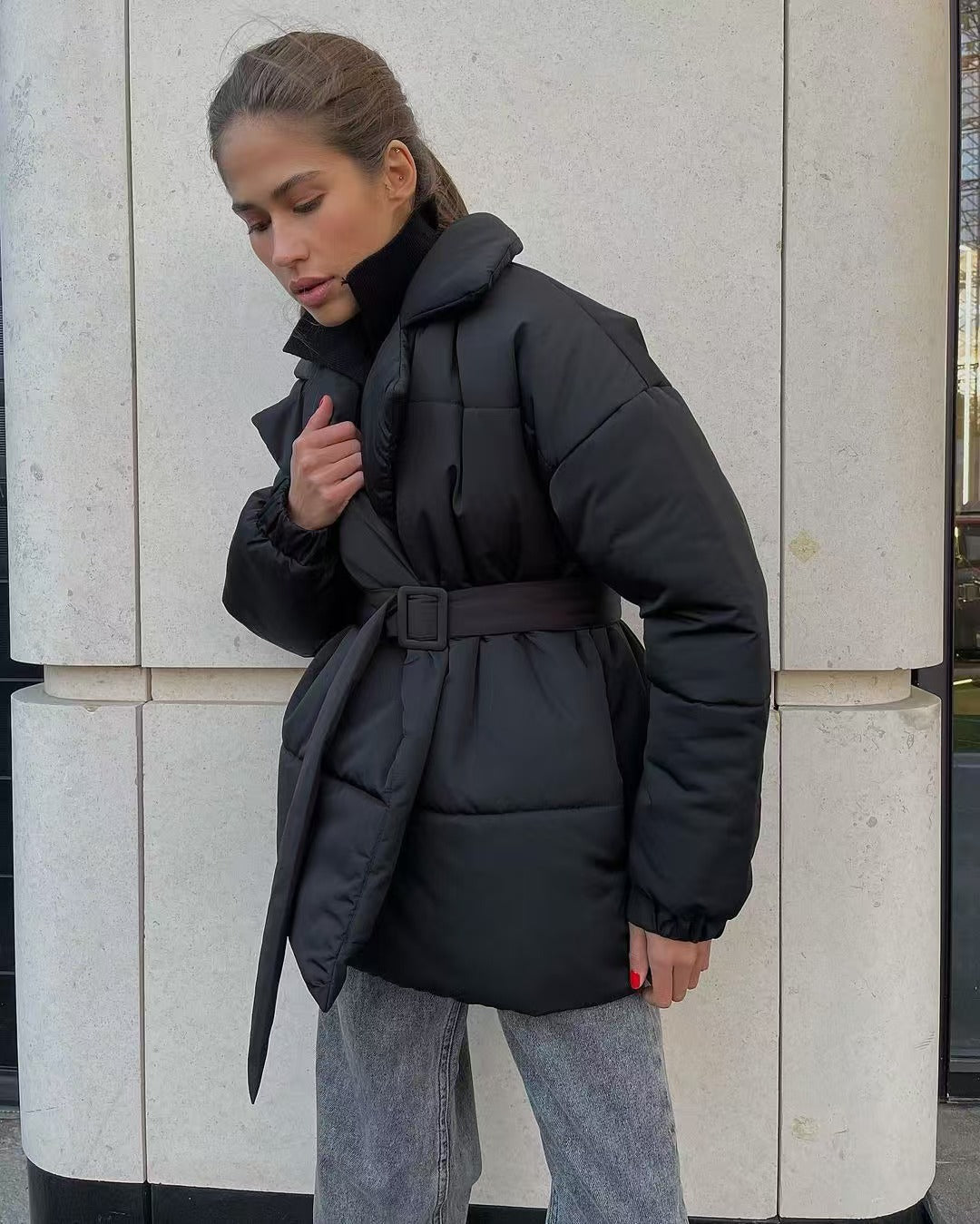 Women's fitted puffer jacket showing back view and quilted construction
