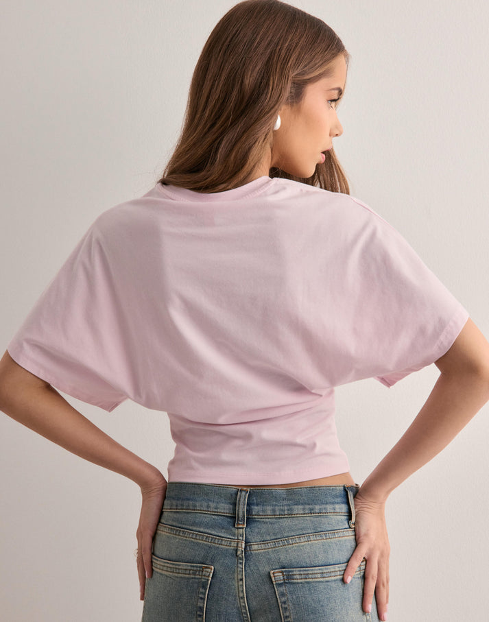 Women's relaxed fit wide sleeve graphic tee in pink — front view