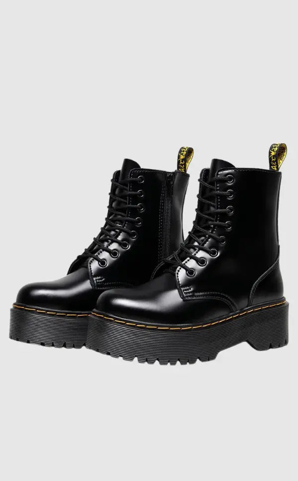 leather platform combat boots with thick sole and metal eyelets displayed at three-quarter view