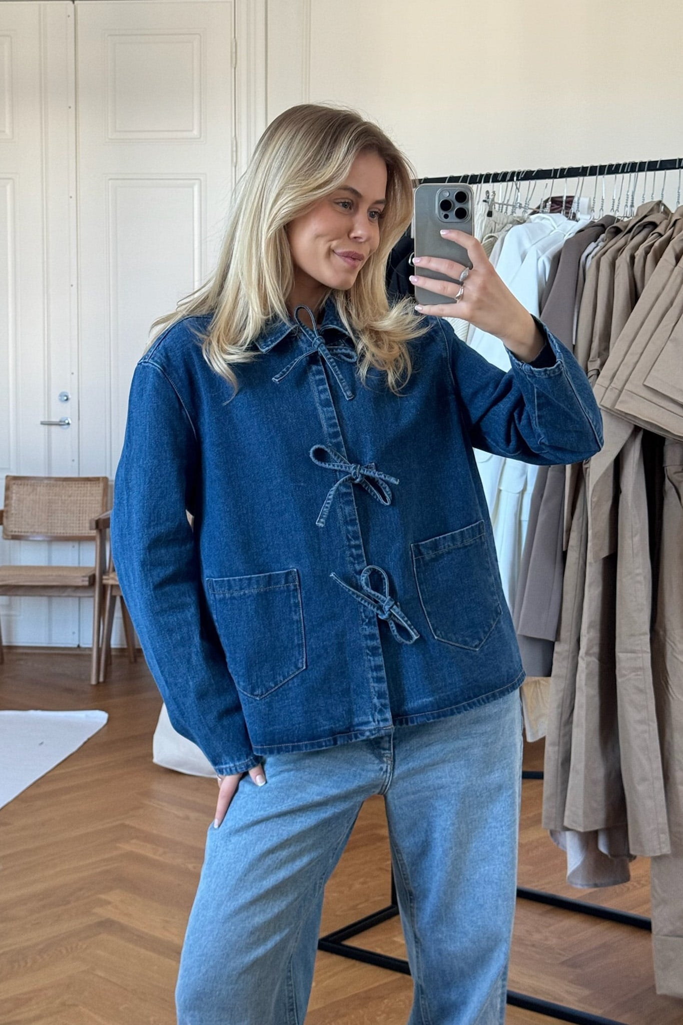 Women's relaxed fit cotton denim jacket with tie waist, side view showing jacket silhouette