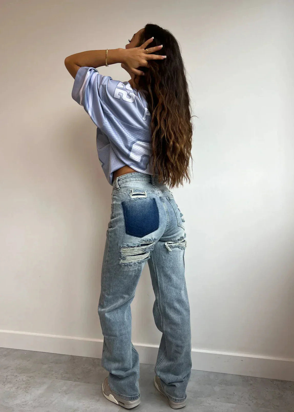 Women's blue spandex ripped jeans in vintage style – front view