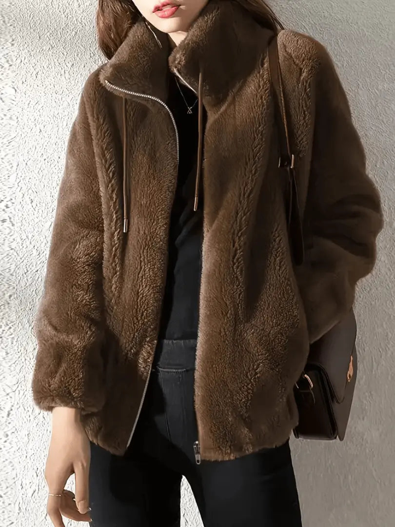 zip up fleece garment with relaxed fit displayed at three quarter view